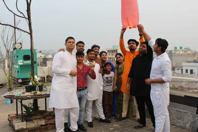 Releasing a sky lantern for Diwali