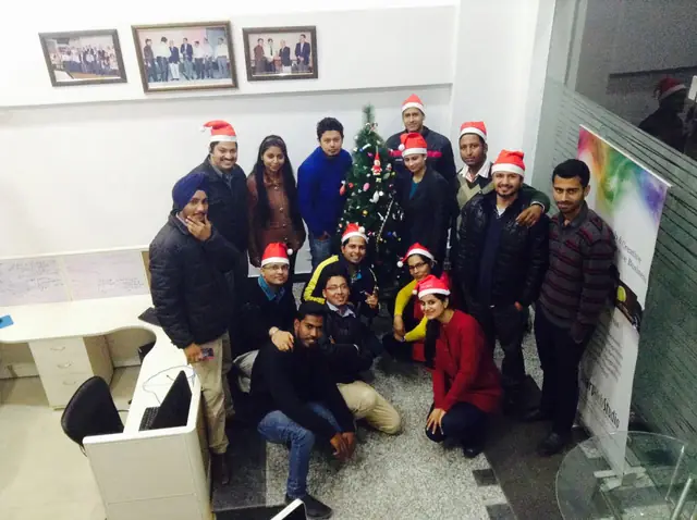 Christmas round the tree at the office