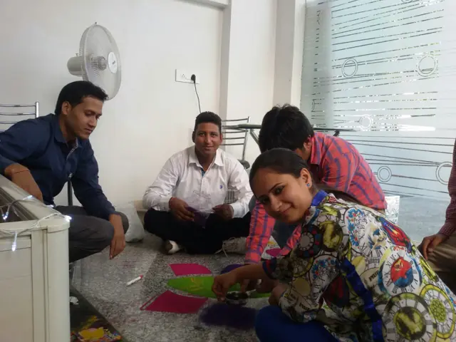 Making the Ganesha rangoli together