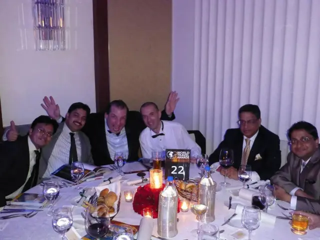Celebrating the CruiseMiles.com win at table 22